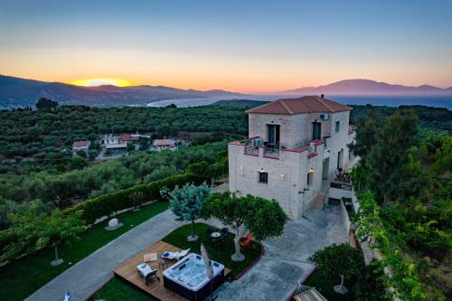 Alonia Villa | Inviting Adam Stone Villa with Ocean Views and Hot Tub