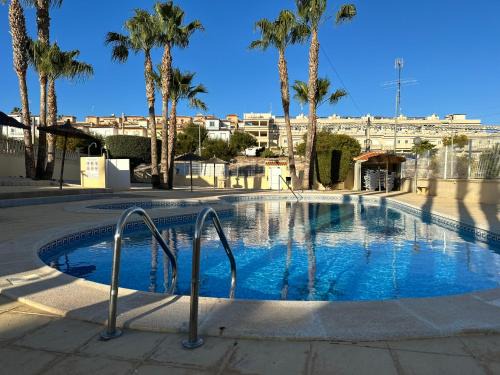 San Miguel de Salinas Apartment | Casa Blue Lagoon: Poolside Relaxation & Ocean Views Await
