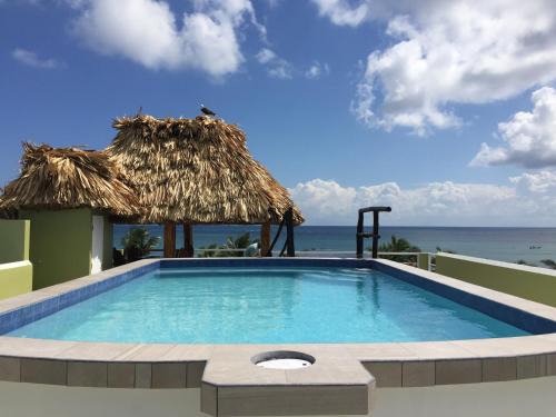San Pedro Hotel | Discover Casa del Rai: Oceanfront Bliss with Pool Access