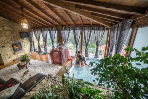 Arcos de Valdevez Resort | Indulge at Casa Favo de Mel with Private Jacuzzi & Ocean View
