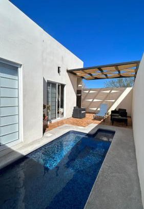 El Centenario Villa | Relax at Casa Relax: Poolside Oasis with Rooftop Lounge