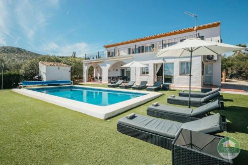 Vinuela Villa | Family-Friendly Casa Wood Villa with Pool & Ocean Views