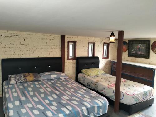 Sri Aman House | Cassava Horbit Room include Aircon