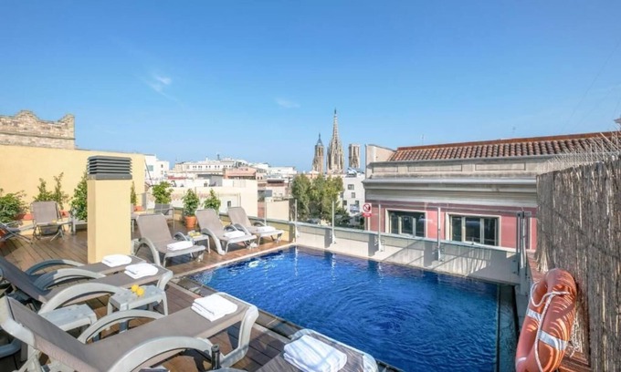 Gothic Quarter Apartment | Cathedral Pool: Relax with Oceanfront Views & Family-Friendly Amenities
