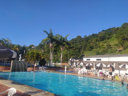 Aguas de Lindoia Apartment | Relax at Cavalinho Branco: Oceanfront Pool & Spa Retreat