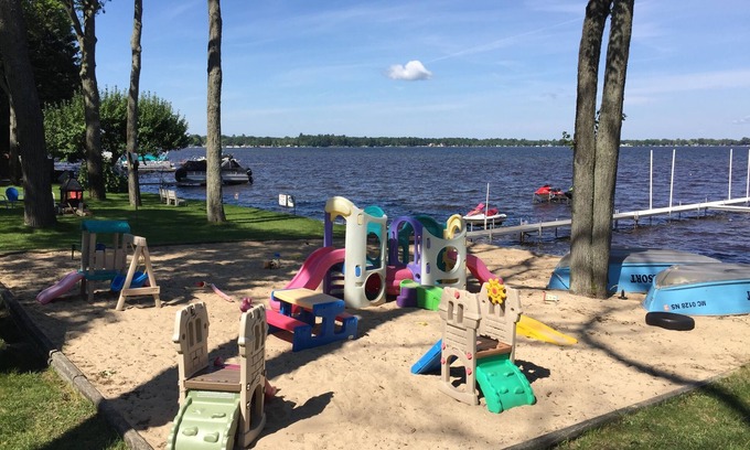 Prudenville Cottage | Relaxing Cedar Oaks Lakeside Resort with Lake Views
