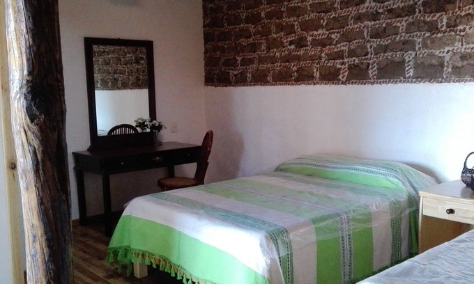 Jocotitlan Hotel | Cozy Cedro Bedroom in Historic 17th Century House