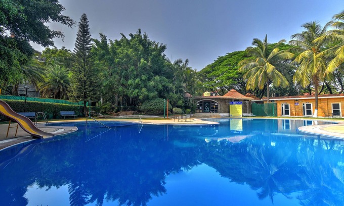 Shamirpet Hotel | Inviting Celebrity Resort with Pool and Dining Options