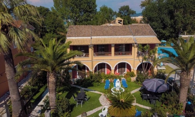 Roda Apartment | Central apartments amidst flower gardens with pool access, 120m from the beach