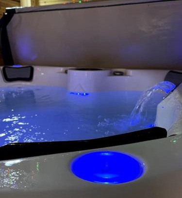 Lincoln House | Modern City Retreat with Hot Tub for Family Enjoyment