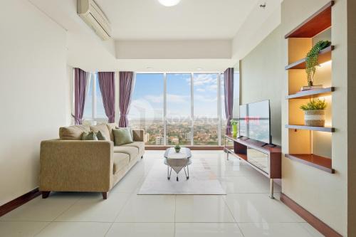 Bangka Apartment | Explore Cera by Kozystay - Kemang: Family-Friendly Retreat