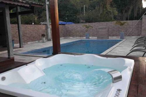 Jardim Aguapeu House | Relax at Chácara 5 Anjos - Oceanfront Retreat with Hot Tub