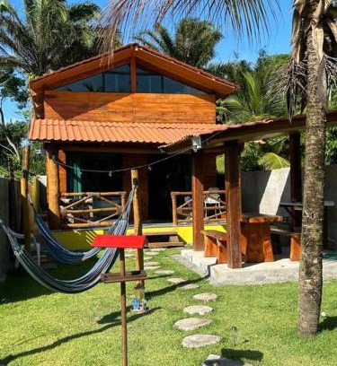 Armacao do Tairu House | Wooden Chalet Steps from the Sea with Cozy Fireplace