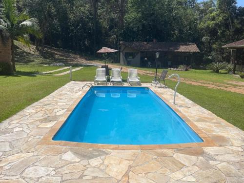 Santo Antonio do Pinhal Cabin | Discover Chalé Rio das Pedras: Oceanfront Getaway Awaits