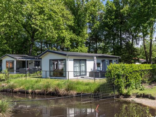 De Bult Ski Chalet | Modern Chalet Retreat with Terrace by a Tranquil Pond
