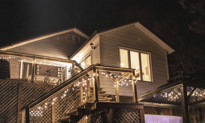 Saint-Calixte Ski Chalet | Relax at Chalet De Mama: Jacuzzi with Scenic Lake Views