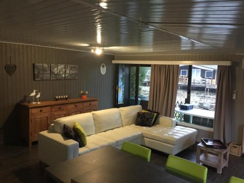 Geel House | Inviting Modern Chalet with Fishing Pond in Scenic Park