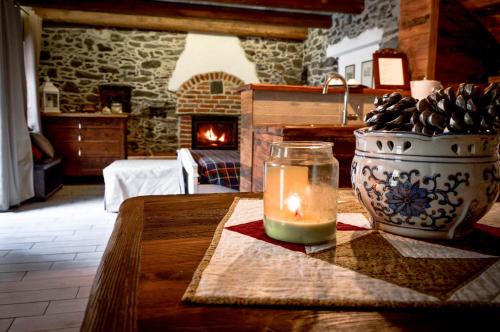 Inverso Pinasca Apartment | Cozy Stone and Wood Chalet with Fireplace & Family Amenities