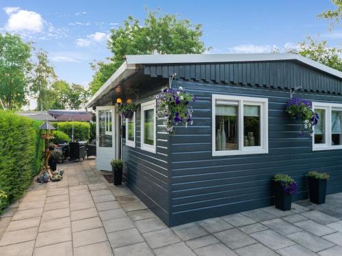 Reutum House | Inviting Wooden Chalet with Pool and Garden in Reutum
