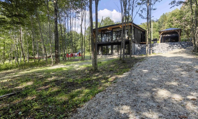 Inverness House | Discover Le Charlo: Mid-Century Chalet by Lake Joseph