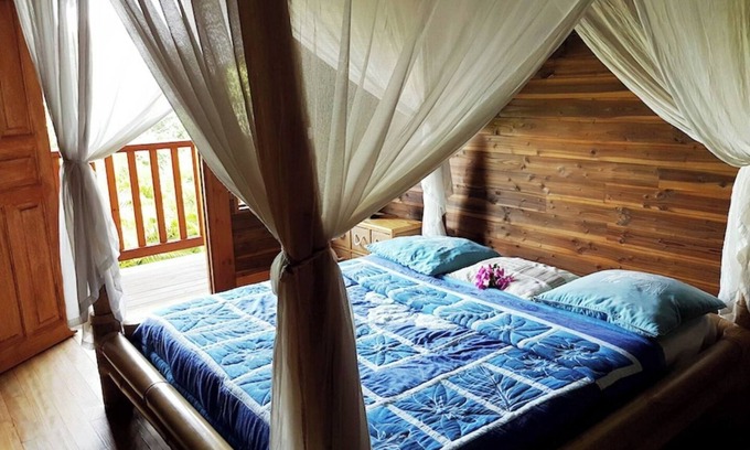 Grande-Terre Ski Chalet | Relax at Chalet Muscade with a Scenic Sea View & Spa