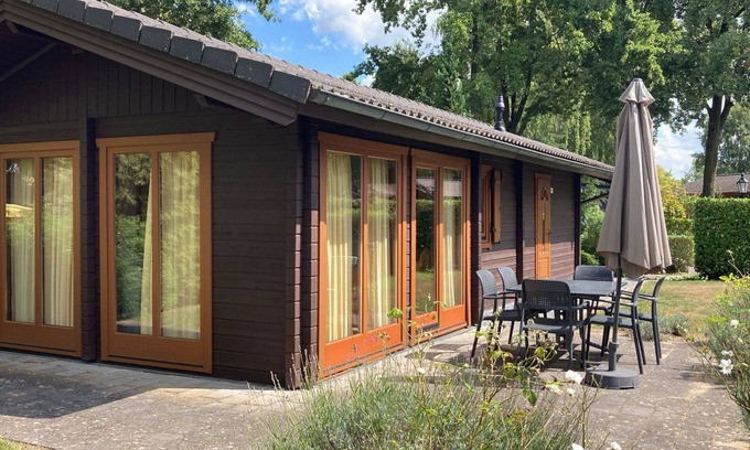 Susteren House | Cozy Chalet with Terrace: Family and Pet Friendly Escape
