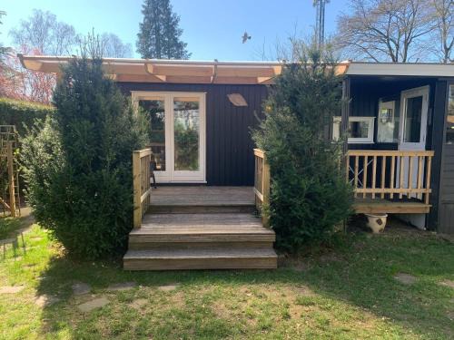 Garderen Ski Chalet | Inviting Chalet with Veranda in Veluwe - Family & Pet Friendly