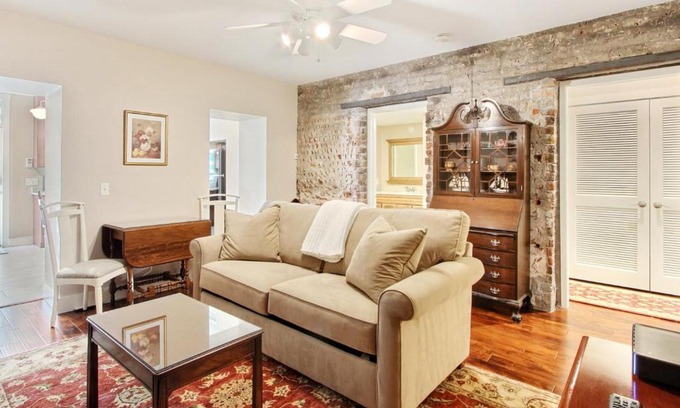 Savannah Victorian District Apartment | Relax at Change of Place Garden Level: Pet-Friendly Oasis