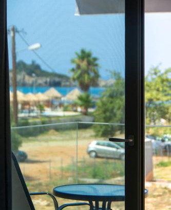 Karavostasi Hotel | Oceanfront Retreat: Charisma Luxury Suite & Rooms