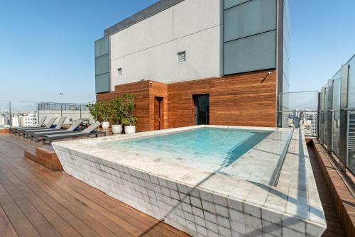 Vila Nova Conceicao Apartment | Discover Comfort at Charlie Forma Itaim with Pool Access