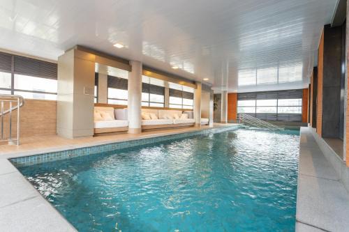Vila Nova Conceicao Apartment | Experience Charlie Itaim: Oceanfront Stay with Pool Access
