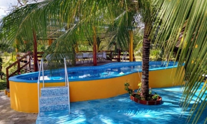 Xul-Ha House | Charming 2-bedroom house with WiFi, AC, Pet Friendly,piscina in welcoming Xul-Ha