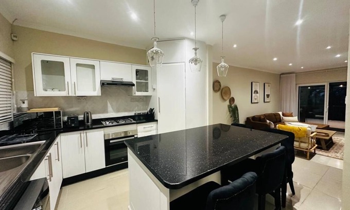 Harare House | Charming 2-bedroom house in peaceful Harare with a Pool ,AC, WiFi & fitness room