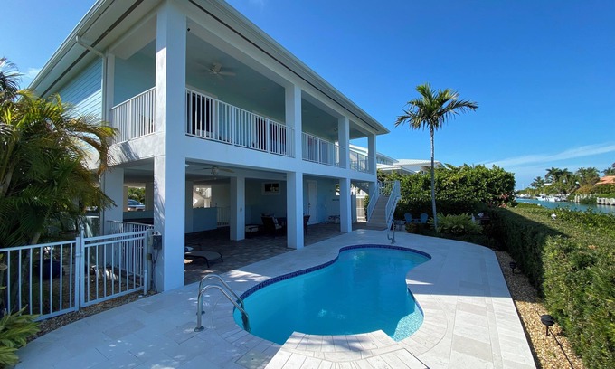 Coury House | Charming 3-bedroom house with pool and boat dock in Key Colony Beach