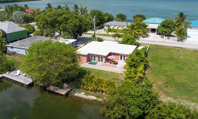 Bay Point House | Charming 3BR canal home close to Key West with kayaks, bikes and park access.