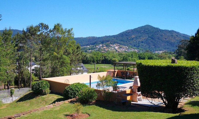 O Rosal Ski Chalet | Inviting Rustic Lodge with Pool and Ocean Views Near Beach