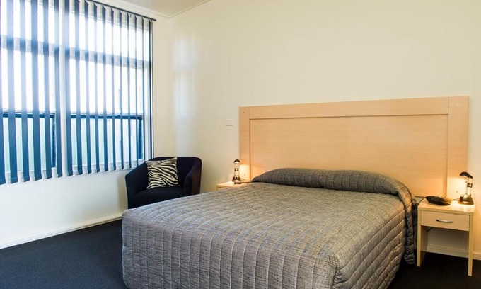 Young Hotel | Cherry Blossom Motor Inn: Cozy Retreat with Hot Tub & Breakfast