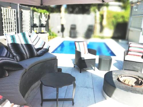 Tokai House | Charming Cherry Cottage: Oceanfront Poolside Retreat