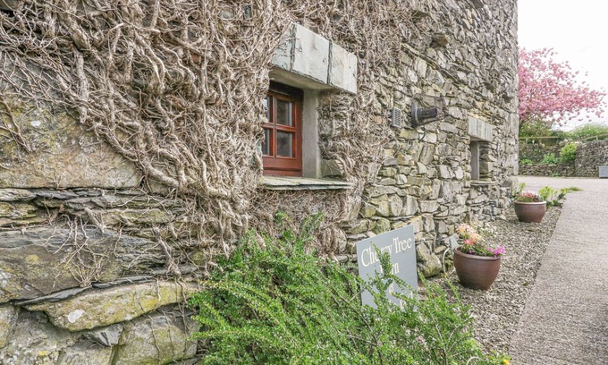 Penny Bridge Cottage | Pet-Friendly Cherry Tree Barn with Cozy Open Fire