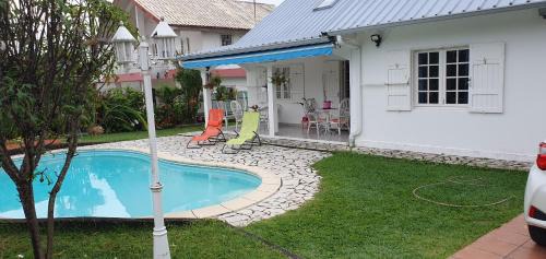 Saint-Benoit Bed & Breakfast | Relax at Chez Mimose et Henri with Pool & Hot Tub Access