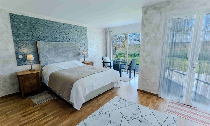 La Pomarede Bed & Breakfast | Discover Chez Phil: Themed Wood Room with Lake Views