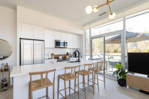 Innisfil Apartment | Stylish 2BR Retreat with Pool, Hot Tub & Patio at Friday Harbour