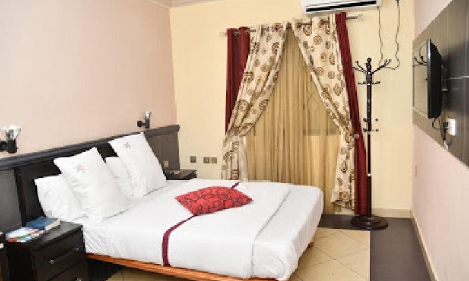 Benin City Cabin | Inviting Room at Choice Gate Hotel with Pool & Hot Tub