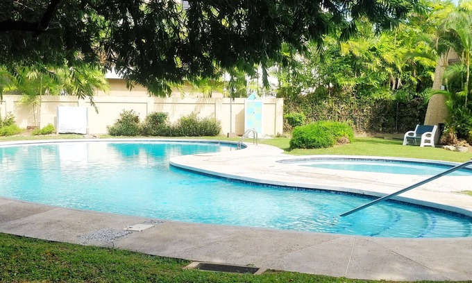Diego Martin Condo | Gated Getaway with Poolside Relaxation and Family Amenities
