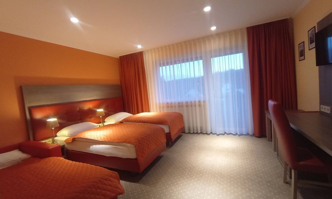 Donaueschingen Apartment | Modern Family Room with Balcony and Spa Amenities