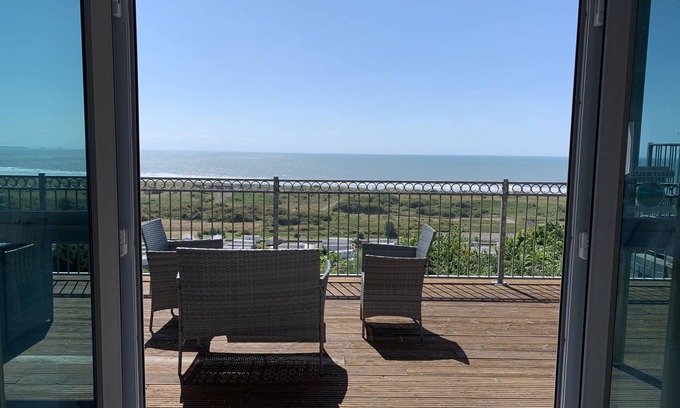 Pendine Cottage | Cliff Haven: Oceanfront Apartment with Breathtaking Views