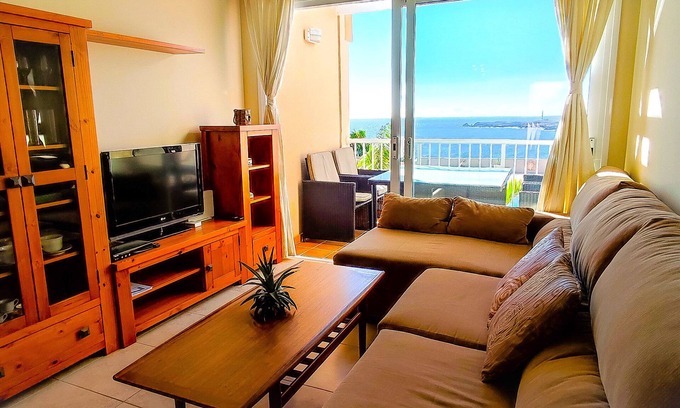 Arico Apartment | Coast Retreat: Ocean & Pool Views with Free WiFi