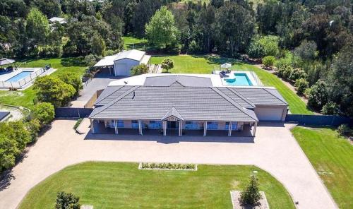 One Mile House | Coast and Country Estate: Poolside Paradise Near the Beach