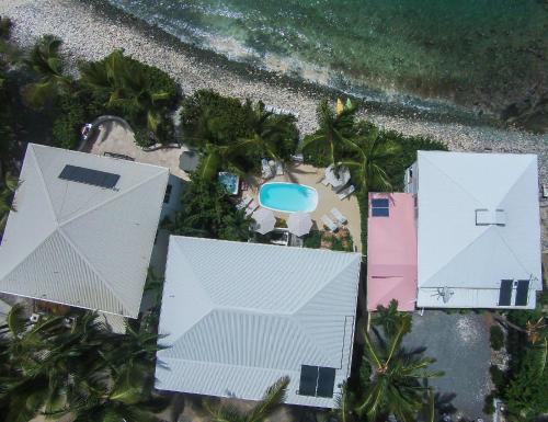 Estate Enighed Apartment | Beachfront Bliss at Coconut Coast Villas - Rated 8.6/10