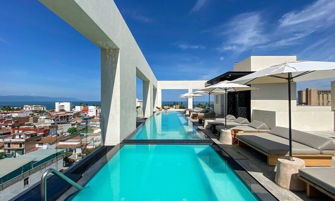 Colonia 5 de Diciembre Condo | Colonial Bliss Penthouse: Poolside Retreat with Ocean Views